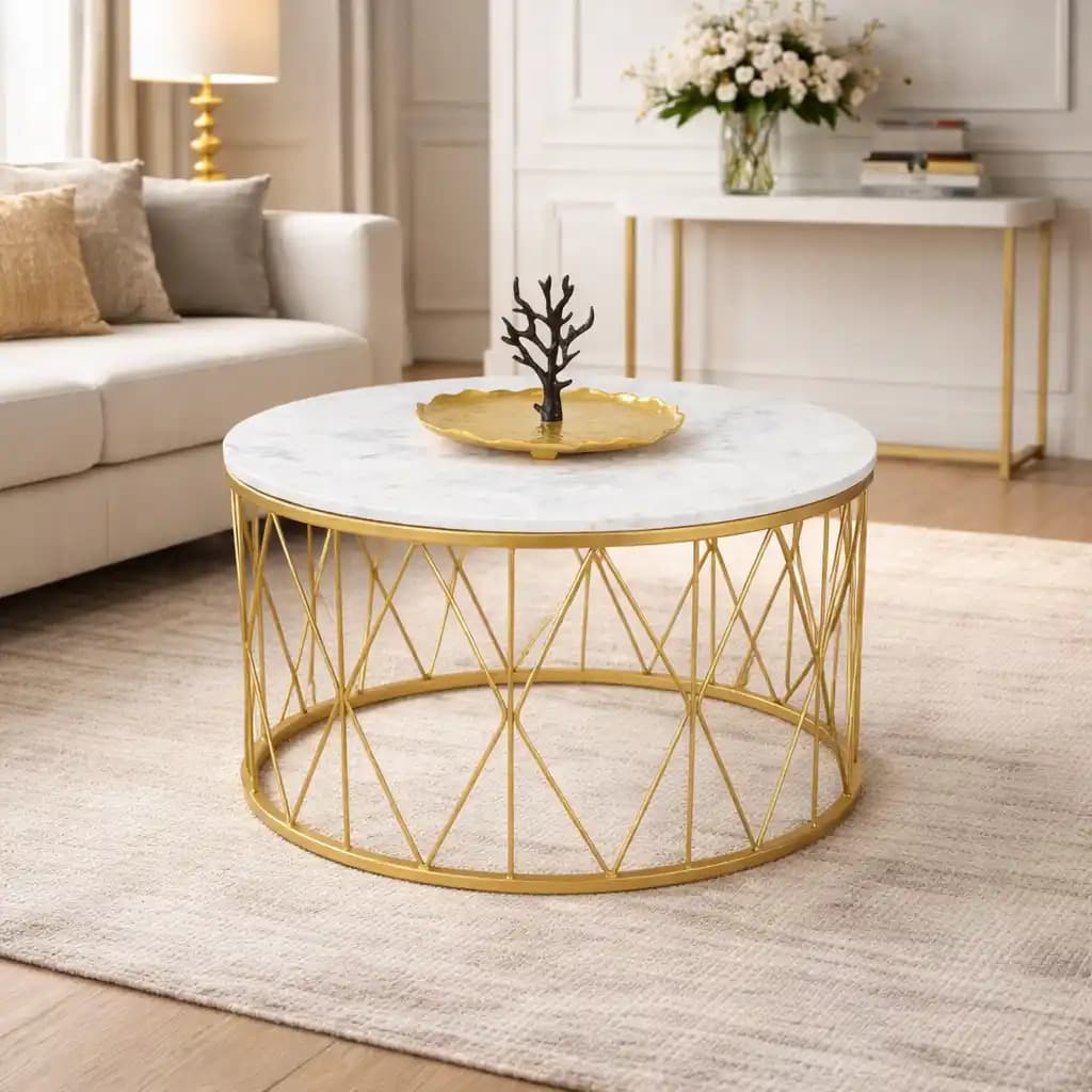 A contemporary round coffee table featuring a polished white marble top and a metallic gold-finished base constructed from slender, interconnected metal rods forming an intricate geometric pattern. The table's design suggests a blend of modern elegance and glamorous aesthetics. — 3D model