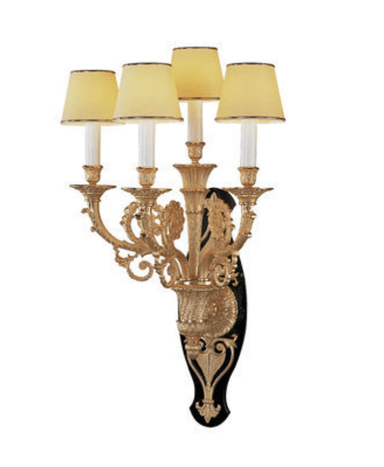 A decorative wall sconce featuring an ornate gilded metal structure with five candle-style lights. The sconce has a black backing plate with intricate gold detailing. Each light is topped with a pale yellow fabric shade with a dark trim. — 3D model