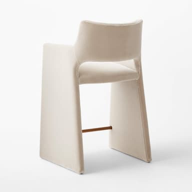 A contemporary bar stool with a sleek, minimalist design. It features a high back and armrests that are integrated into the main frame. The seat is upholstered, and the legs are substantial and straight. A metallic footrest spans between the two front legs, providing additional stability and functionality. — 3D model