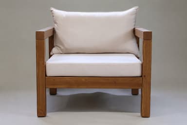 A sturdy armchair featuring a robust wooden frame and plush, light-colored cushions for seating and back support. The design is rectilinear and minimalist. — 3D model