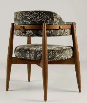 An upholstered armchair with a wooden frame, featuring a dark teal velvet fabric with a light-colored abstract pattern. The chair has tapered wooden legs and integrated upholstered armrests. — 3D model