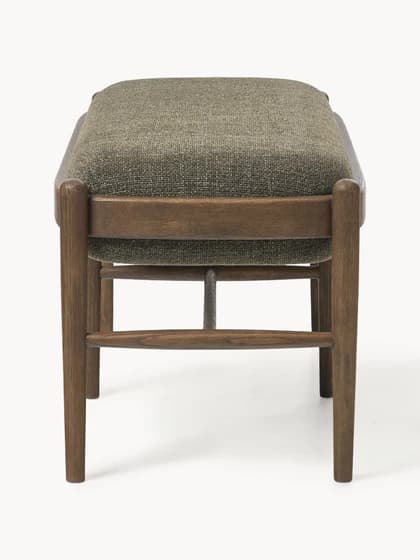 A rectangular upholstered ottoman featuring a solid wooden frame with rounded edges and four tapered legs. The top is generously padded and covered in a textured, greenish-brown fabric, while horizontal wooden stretchers provide structural support. — 3D model