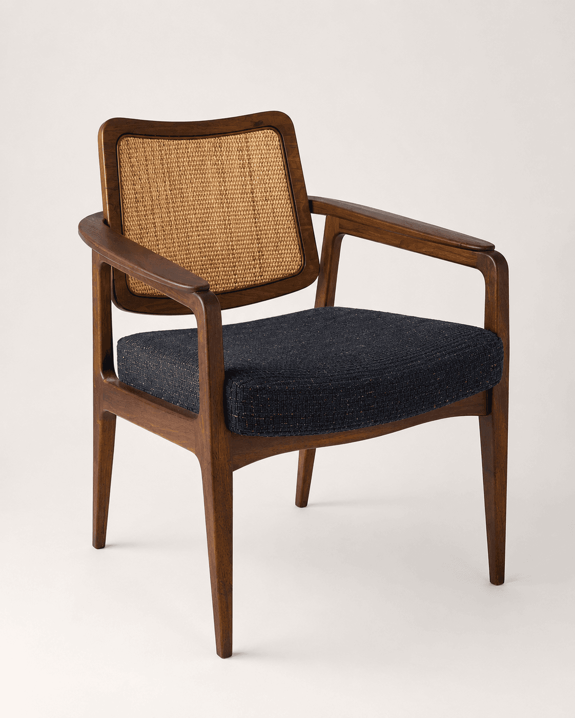 A wooden armchair featuring a cane backrest and an upholstered seat cushion. — 3D model