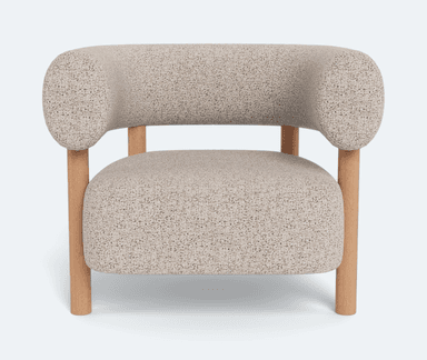 A single accent chair featuring a rounded, enveloping backrest and seat upholstered in a textured, light-colored boucle or similar fabric. The chair is supported by a minimalist frame constructed from light-toned wood, with four cylindrical legs extending from the base and two upright supports that integrate into the armrests and connect to the backrest. The design blends soft, organic curves with a clean, natural material aesthetic. — 3D model