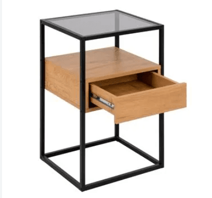 A modern industrial-style side table featuring a black rectangular metal frame, a light-toned wooden drawer, and a clear tempered glass top surface. The drawer is positioned mid-height within the frame, and there is an open storage space below it. — 3D model