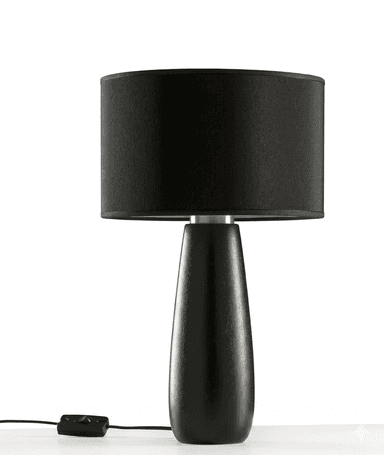 A modern table lamp featuring a cylindrical black fabric drum shade atop a sleek, tapered base made of black wood. The lamp is connected to a black electrical cord with an inline switch. — 3D model