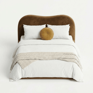 A modern upholstered bed featuring a distinctive wavy headboard and a low-profile frame. The bed is covered in a rich, brown velvet-like fabric, presenting a soft and luxurious appearance. It is dressed with clean white bedding, including two standard pillows and a duvet, accented by a round mustard-colored velvet pillow and a chunky knit beige throw blanket draped across the foot of the bed. The overall design emphasizes organic shapes and contemporary elegance. — 3D model
