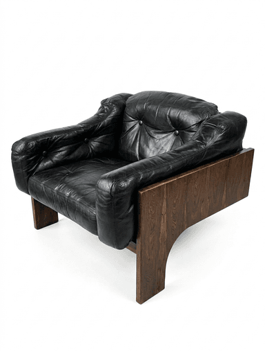A robust lounge chair featuring a distinctive dark wood veneer frame, likely rosewood, with deep-set black leather cushions. The chair's base forms a solid, geometric structure with cut-out arches, providing a foundational aesthetic. The upholstery consists of plush, padded black leather, including a seat cushion, backrest, and armrests, suggesting a comfortable seating experience. The overall design exhibits characteristics of Mid-Century Modern style with a touch of architectural solidity. — 3D model