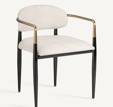 A modern armchair with a gently curved back and seat, upholstered in a textured light-colored fabric. The chair features sleek, tapered legs in black, and its armrests are formed by a continuous metal tube with a brass finish, attached to the frame. — 3D model