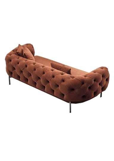 A contemporary chaise lounge upholstered in tufted rust-brown velvet, featuring a curved design and supported by thin black metal legs. Includes two matching toss pillows. — 3D model