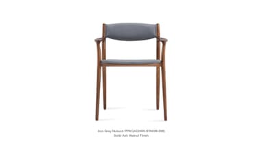 A side profile view of a modern armchair with a wooden frame and upholstered seat and backrest. The frame is constructed from solid ash with a walnut finish. The upholstery appears to be a light grey nubuck fabric. — 3D model