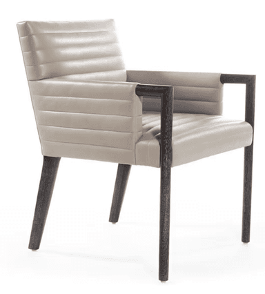 A contemporary armchair featuring horizontal channel tufting on the backrest and seat, upholstered in a light beige material. The chair has exposed dark-finished wooden or metal armrests that extend into tapered front and splayed rear legs, providing a stable and stylish base. — 3D model
