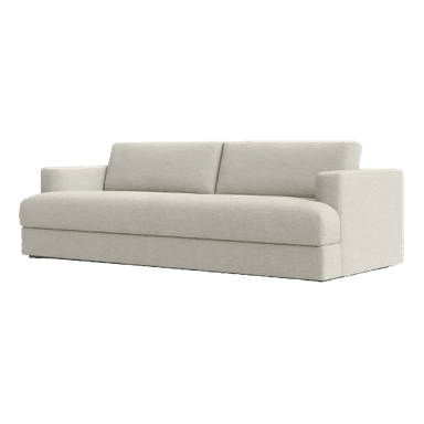A cream-colored sofa seen from a rear three-quarter perspective. The sofa has a plush, upholstered design with two prominent back cushions. The base is a solid rectangular block, and the armrest on the visible left side is rounded and integrated into the main structure. The fabric appears to have a textured weave. — 3D model