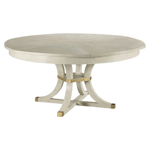 A round dining table featuring a light, possibly whitewashed wood finish on both the tabletop and the sculptural pedestal base. The tabletop displays a subtle starburst veneer pattern. The robust pedestal base consists of curved, intersecting supports, enhanced by brass accents at the central connection point and on the feet, providing both stability and decorative detail. — 3D model