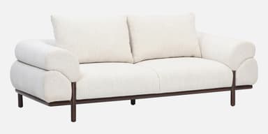 A contemporary loveseat upholstered in off-white bouclé fabric, featuring a plush, rounded design, broad armrests, and a recessed dark wood base with short, cylindrical legs. — 3D model