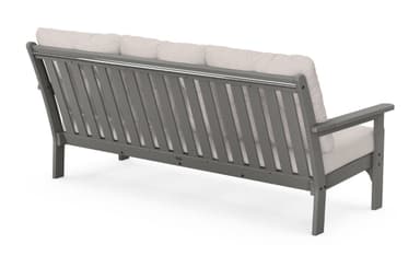 A three-seater sofa with a grey, angular frame and light beige cushioned seating and backrest. The backrest is composed of three separate tufted cushions, each secured with a single button. The armrests are straight and extend from the frame. The sofa has a clean, modern aesthetic, likely intended for outdoor use. — 3D model