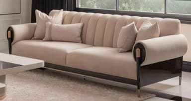 A contemporary three-seater sofa featuring a channel-tufted backrest and scrolled armrests. The sofa is upholstered in a light beige fabric and sits on a dark wood base with brass accents. — 3D model
