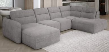 A large, modular sectional sofa with a chaise lounge attachment. The sofa features multiple seating sections with plush cushions and a textured fabric upholstery. It has a low-profile design with clean lines and appears to be a contemporary style. — 3D model