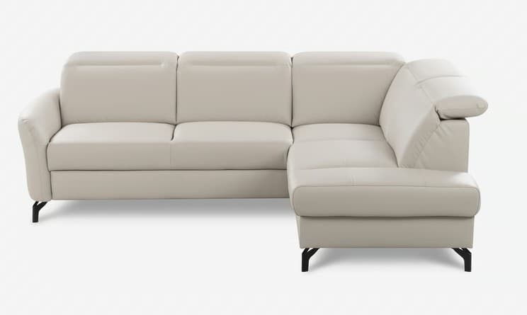 An L-shaped sectional sofa upholstered in a light beige or off-white material, likely leather or faux leather. It features a three-seater section connected to a right-hand facing chaise lounge. The backrests have distinctive padded headrest sections, and the sofa rests on sleek, minimalist black metal legs. — 3D model