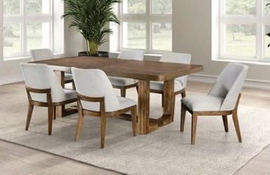 A rectangular wooden dining table with gently rounded corners on its tabletop. The table is supported by a distinctive integrated trestle base, consisting of two solid end supports connected by a central stretcher. The tabletop features a subtle, recessed cross-pattern detail. — 3D model