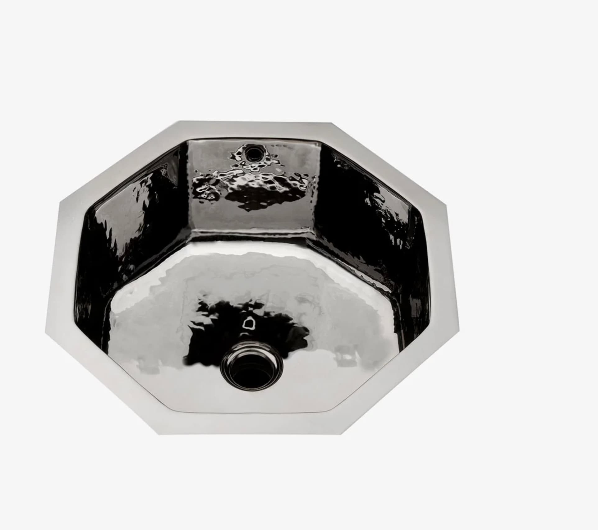 An octagonal, drop-in or undermount sink made from polished metal, possibly stainless steel. The interior basin features a distinctive hammered texture, while the rim and exterior appear smooth. It includes a central drain opening and a smaller overflow hole on one side of the upper interior. — 3D model