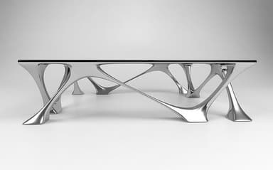 A modern coffee table featuring a rectangular black glass top supported by a highly sculptural, polished silver-tone metal base with organic, branching leg structures. — 3D model