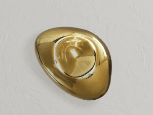 A modern wall-mounted light fixture featuring a fluid, organic, and irregularly shaped front in a highly polished chrome or metallic finish. It is mounted on a flat, dark backplate, contrasting with the reflective, undulating surface of the main light element. The design is sculptural and abstract, intended to provide ambient light while serving as a decorative art piece. — 3D model