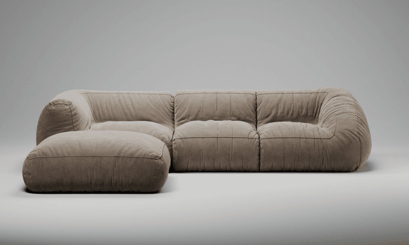 A modular sectional sofa with an accompanying ottoman. The sofa features a low profile, plush cushioning, and a fabric upholstery. The design is characterized by rounded forms and segmented seating areas achieved through stitching. — 3D model