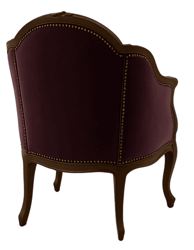 A tufted armchair with a carved wooden frame. The upholstery is a deep purple velvet, and the frame appears to be made of dark wood. Decorative brass tacks are visible along the edges of the upholstery, accentuating the curves of the frame and upholstery. — 3D model