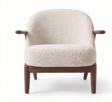 A contemporary armchair featuring an exposed dark wood frame with a curved backrest and integrated armrests. The seat and back are generously upholstered in a cream or off-white boucle fabric, providing a textured and plush appearance. The legs are tapered and splayed, contributing to an elegant and lightweight silhouette. — 3D model