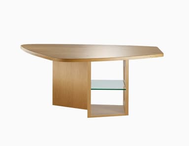 A contemporary coffee table constructed from light-toned wood, possibly oak, featuring an irregularly shaped top with rounded corners. The base is composed of solid wood panels, one forming a broad side support, and another central structure that includes a compartment with multiple circular cutouts and an integrated clear glass shelf. The overall aesthetic is modern and minimalist with unique design details. — 3D model