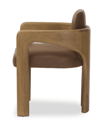A contemporary armchair featuring a solid wood frame, likely oak, with a light brown finish and visible grain. The design includes a deeply curved backrest that gracefully extends to form integrated armrests. A plush brown leather or faux leather upholstery is visible on the seat and inner backrest, providing a contrast to the natural wood. The chair's legs are sturdy and straight, complementing the clean lines of the design. The overall aesthetic is modern, sculptural, and organic. — 3D model