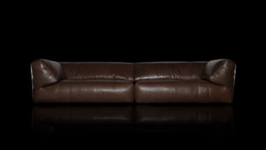 A contemporary brown leather sofa, characterized by its low-profile design and generously padded, inward-sloping arms. The seating features two large, plush cushions, suggesting a comfortable and relaxed seating experience. The leather exhibits a slightly worn, supple texture, hinting at quality material. — 3D model