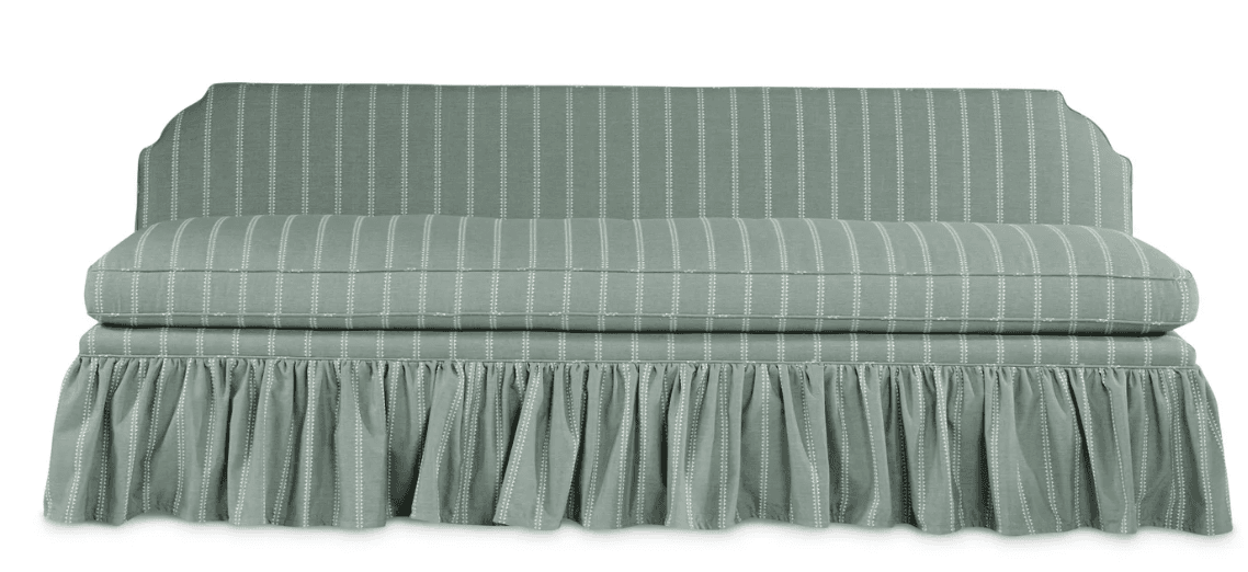 An upholstered dining bench with a high backrest and a full, pleated skirted base, featuring a light sage green fabric with white pinstripes. — 3D model