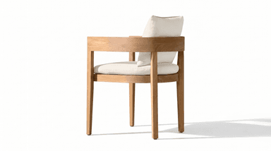 A modern armchair featuring a rectilinear wooden frame constructed from a light-toned hardwood, possibly teak. The chair includes a thick seat cushion and a back cushion, both upholstered in an off-white or cream-colored fabric. The frame has prominent, flat armrests and straight legs, emphasizing a clean, minimalist aesthetic. — 3D model