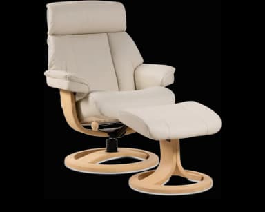 A contemporary recliner chair and matching ottoman, upholstered in cream-colored faux leather, with light-toned bentwood bases. The chair features a padded headrest, backrest, seat, and armrests, supported by a circular swivel base. The separate ottoman provides elevated leg support, mirroring the chair's design and materials. — 3D model