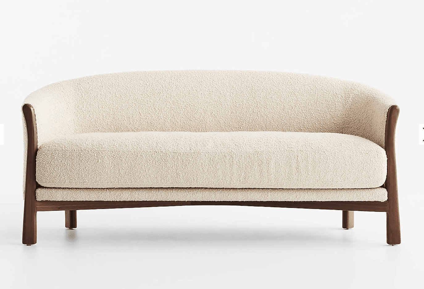 A two-seater loveseat featuring a curved back and integrated armrests, upholstered in a light-colored, textured boucle fabric. It is supported by a visible dark wood frame that extends from the base to form the armrests and partially the back structure. The loveseat rests on four short, solid wooden legs. — 3D model