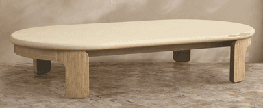 A cream-colored, oval-shaped decorative panel with a smooth, matte finish and softly rounded edges, presented against a subtly textured beige background. The object has a uniform thickness and a minimalist aesthetic. — 3D model