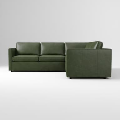 An L-shaped sectional sofa upholstered in a rich green leather or faux leather, featuring a contemporary design with clean lines and square arms. — 3D model