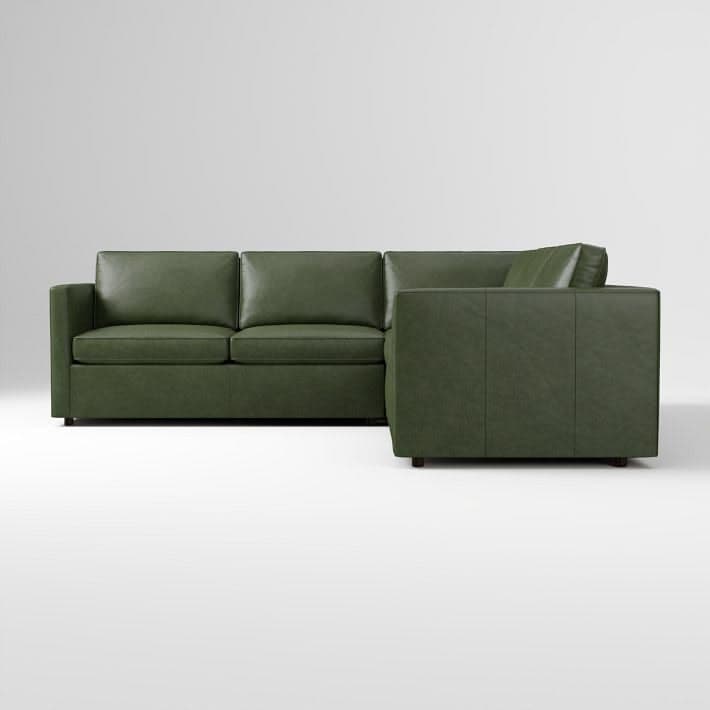 An L-shaped sectional sofa upholstered in a rich green leather or faux leather, featuring a contemporary design with clean lines and square arms. — 3D model
