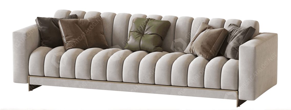 A contemporary three-seater sofa featuring a distinctive fluted design on its backrest and seat cushions. The sofa is upholstered in a light beige, possibly velvet or boucle, fabric. It has clean, straight track arms and rests on a recessed, minimalist metal base with a brass or gold finish. Several decorative throw pillows in varying sizes and muted earth tones, some with subtle tufting, are arranged on the sofa. — 3D model