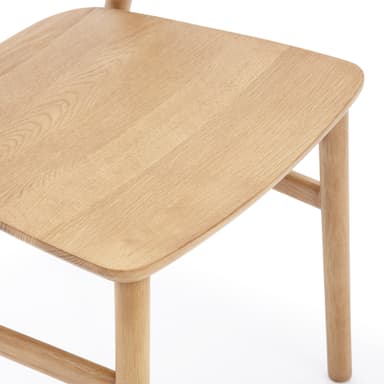 A light-toned solid wood chair, likely oak or ash, featuring a minimalist design with a smoothly curved backrest and a subtly contoured seat. It has four straight, round legs connected by stretchers, and no armrests. — 3D model