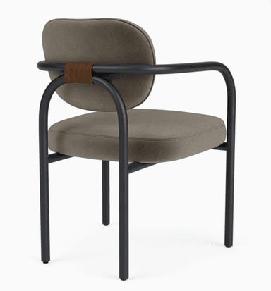 A modern upholstered armchair featuring a dark gray fabric seat and back, supported by a sleek black tubular metal frame. The design includes rounded armrests and legs, providing a minimalist yet comfortable aesthetic. — 3D model