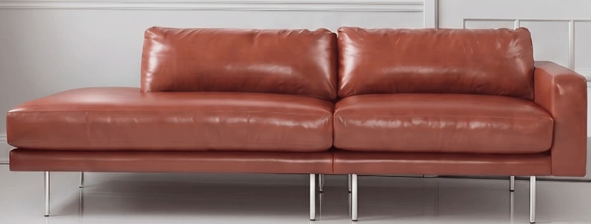 An L-shaped sectional sofa upholstered in a warm cognac brown leather, featuring clean lines and a modern aesthetic. It includes a spacious chaise lounge component and rests on slender, cylindrical metal legs. — 3D model
