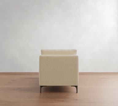A contemporary upholstered daybed with integrated armrests at both ends, featuring a flat seating surface and two loose bolster cushions for back support, all resting on slender metal legs. — 3D model