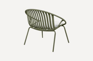 A modern armchair with a rounded, slatted back and seat, featuring a minimalist design. The frame is constructed from slender metal tubing, and it includes a white cushion for comfort. The chair is supported by four thin legs. — 3D model