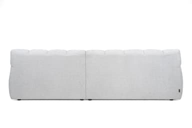 The image shows the back view of a contemporary sectional sofa module. It is upholstered in a light gray, subtly textured fabric. The backrest features horizontally segmented panels along the top, suggesting individual plush cushions or a channeled design. A clear vertical seam down the center indicates it is either a two-seater back or two joined modules. The base is low-profile with small, dark feet. — 3D model