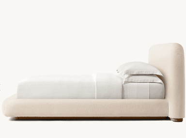 A low-profile bed frame with a rounded headboard and platform base, upholstered in a textured, light-colored fabric. The bed is dressed with white bedding, including two pillows stacked neatly. — 3D model
