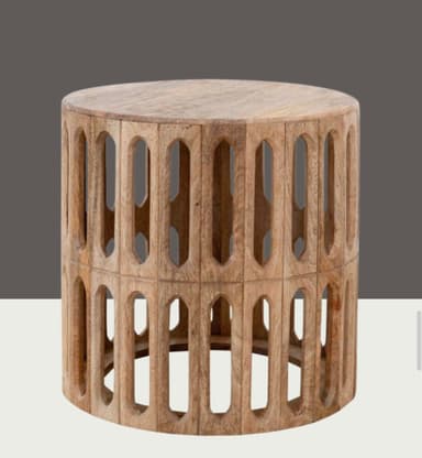 A round wooden table with a solid top and a cylindrical base featuring two tiers of carved, elongated arch cutouts forming a decorative fretwork pattern. The wood has a light, natural finish. — 3D model