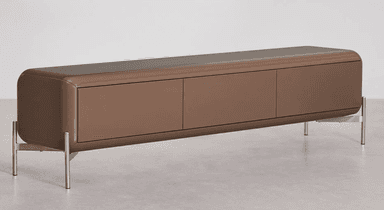 A low-profile, elongated sideboard with a rounded rectangular form. It features three cabinet doors across the front and stands on four slender, angled metal legs. The overall design appears modern and minimalist, with a smooth, matte finish. — 3D model